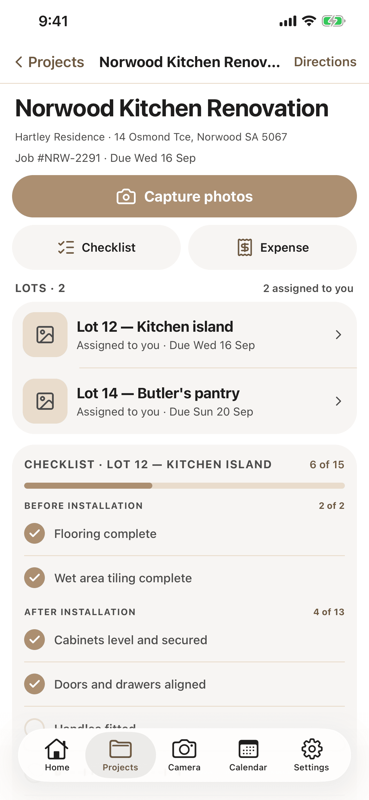 CabiPro job screen on iPhone showing the Norwood Kitchen Renovation, its two assigned lots, and an install checklist six steps of fifteen complete.